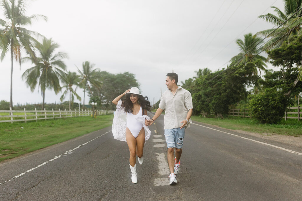 couple posing on a beach in hawaii
