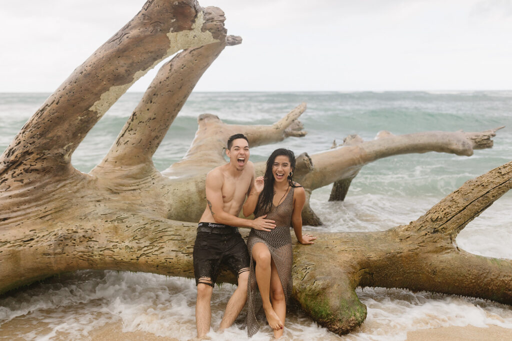 couple posing on a beach in hawaii