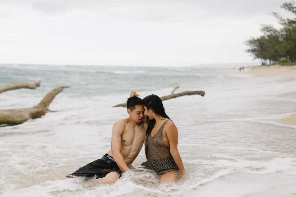 couple posing on a beach in hawaii
