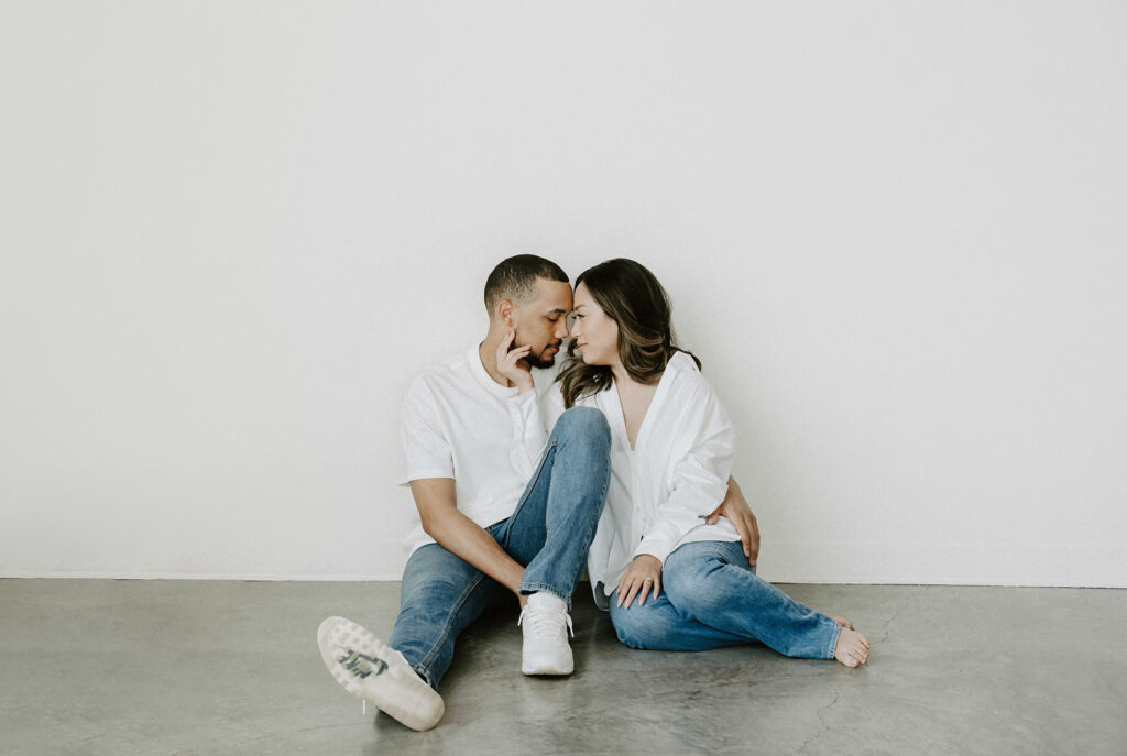 couple posing in downtown portland in a studio for their engagement photos