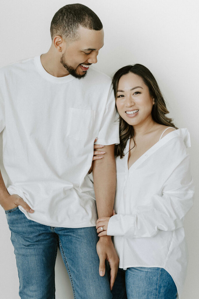 couple posing in downtown portland in a studio for their engagement photos