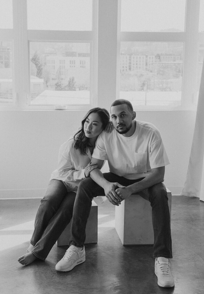 couple posing in downtown portland in a studio for their engagement photos