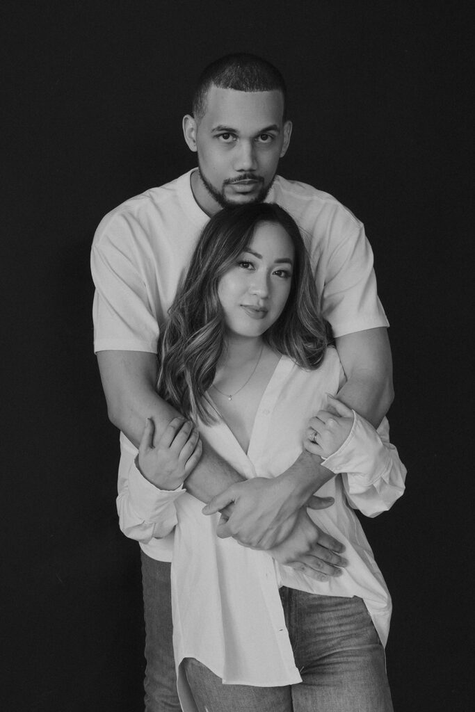 couple posing in downtown portland in a studio for their engagement photos