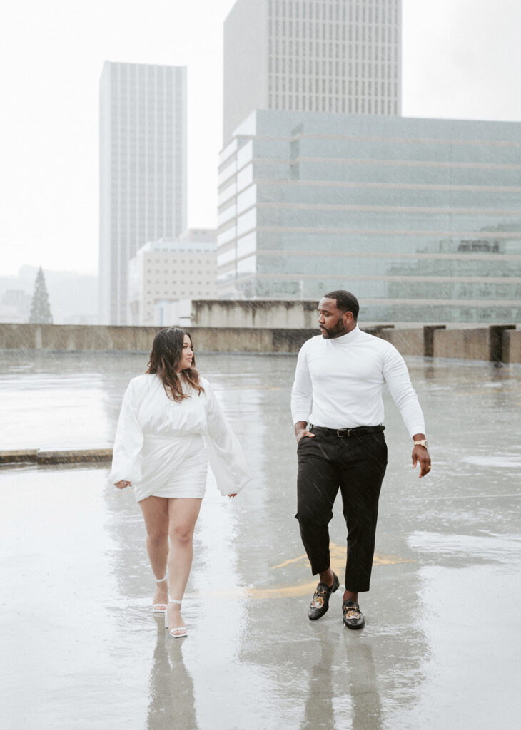 couples in downtown portland posing for their city engagement photos