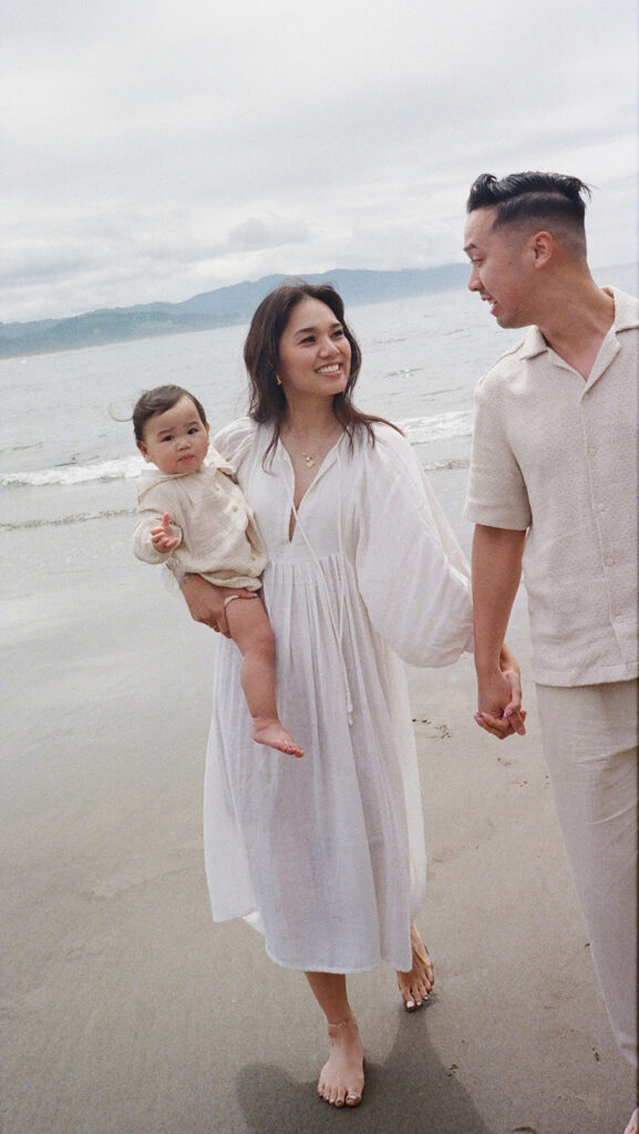 mom and dad posing with baby for their family session
