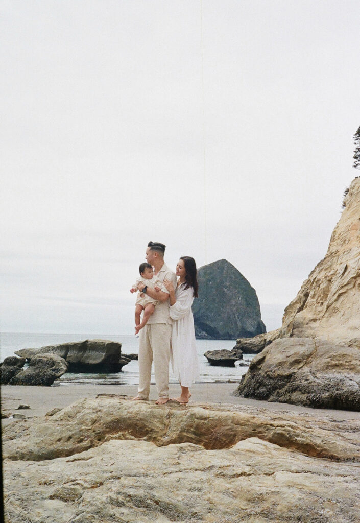 mom and dad posing with baby for their family session
