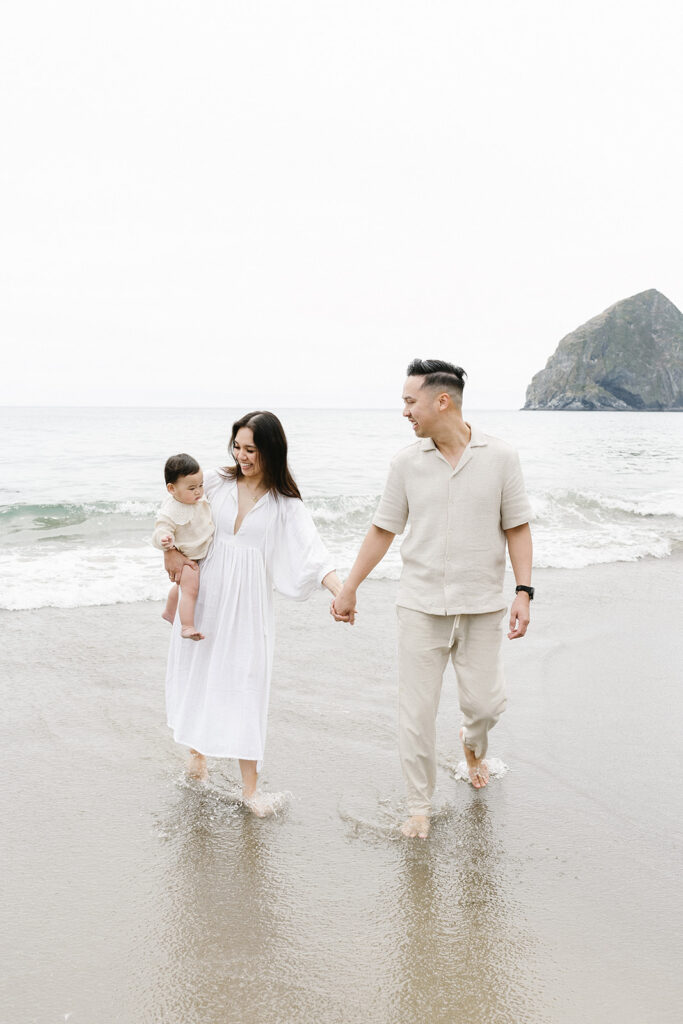 mom and dad posing with baby for their family session
