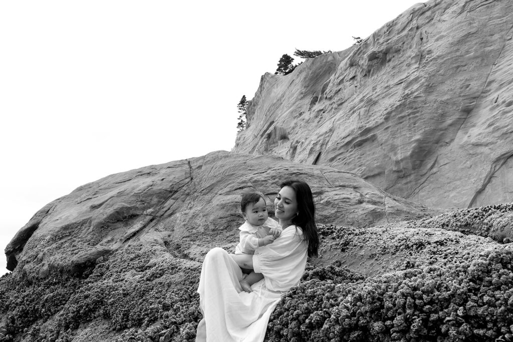 mom and dad posing with baby for their family session
