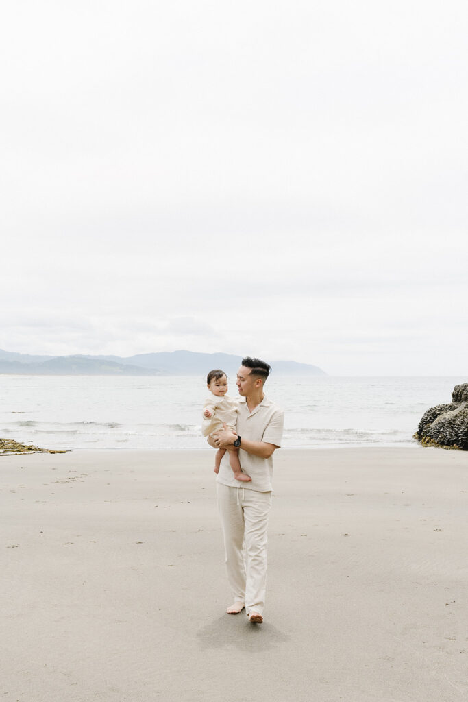 mom and dad posing with baby for their family session
