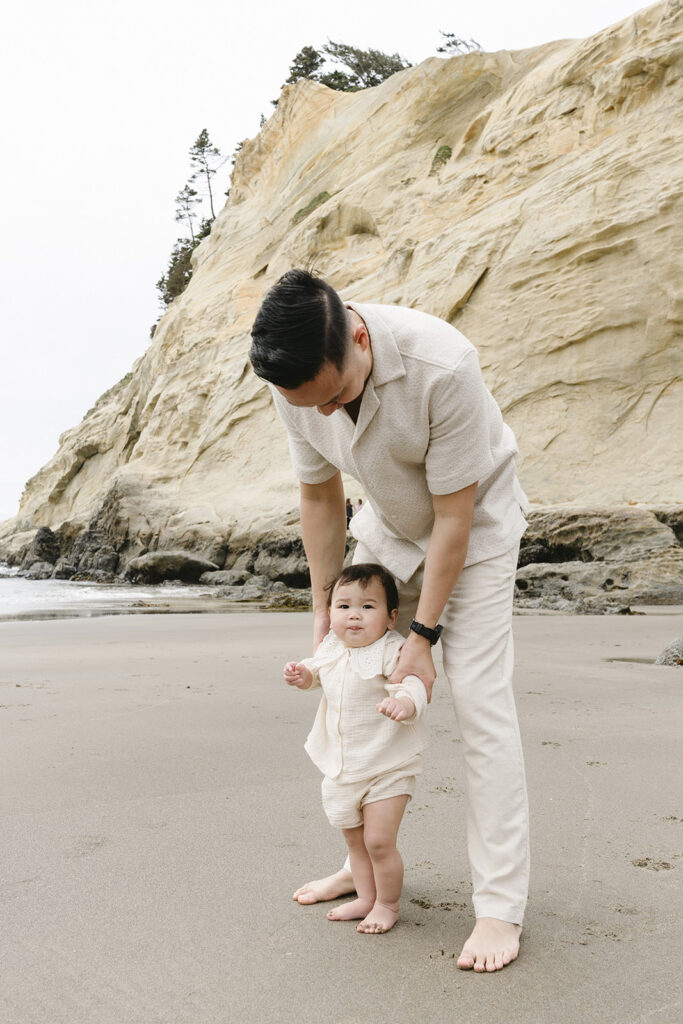 mom and dad posing with baby for their family session
