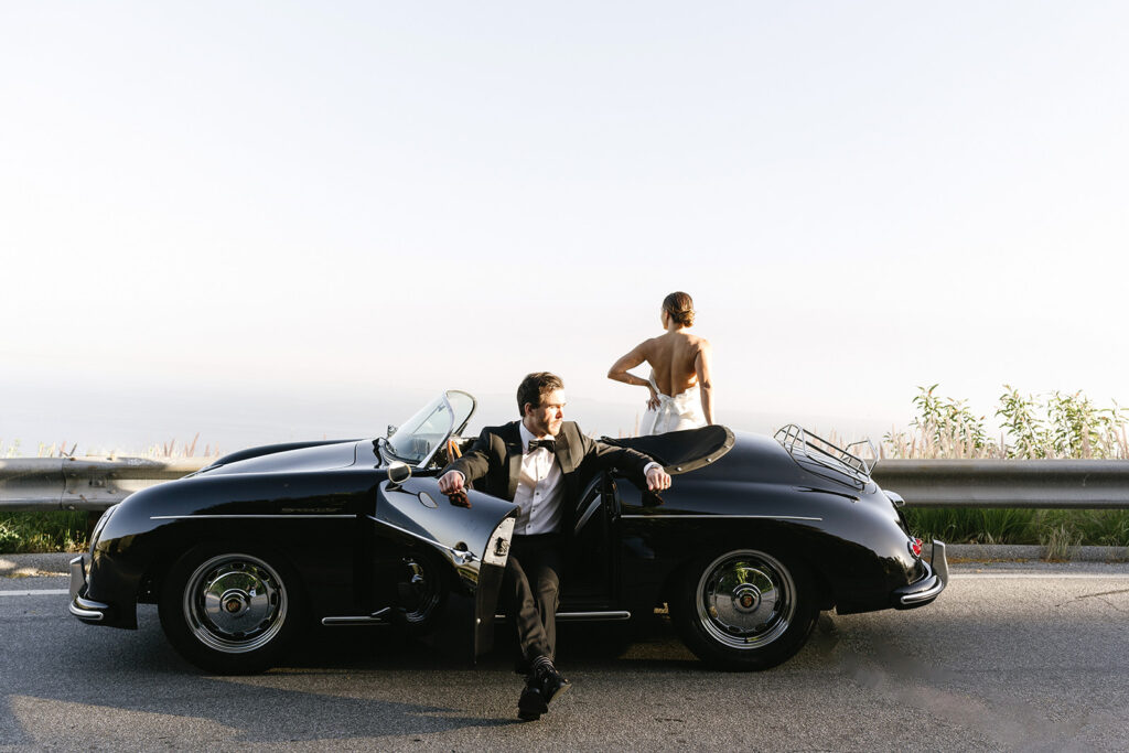 couple posing with a vintage car for their engagement photos
