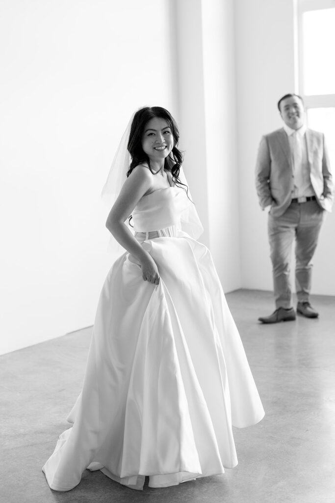 couple posing for a wedding photoshoot at a studio
