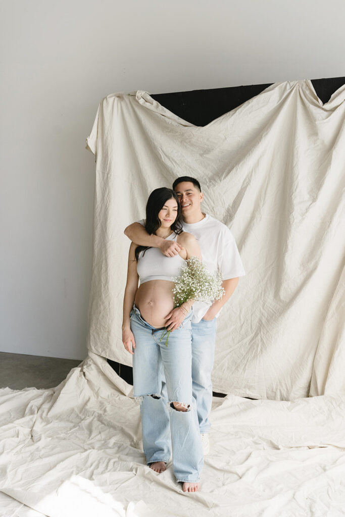 couple taking maternity photos in portland
