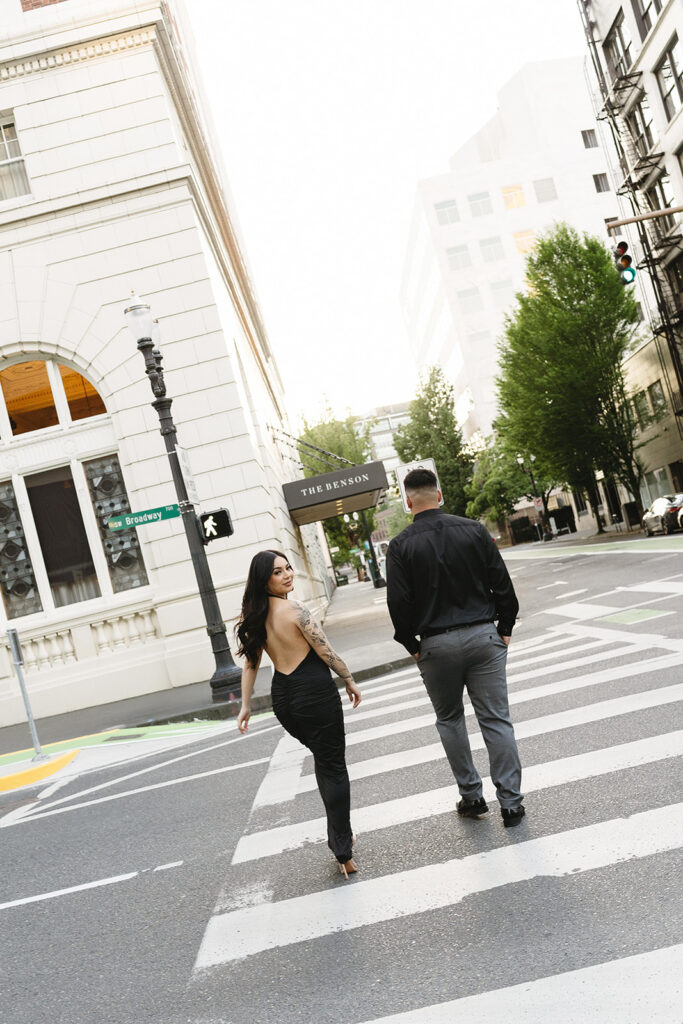 couple downtown taking engagement photos
