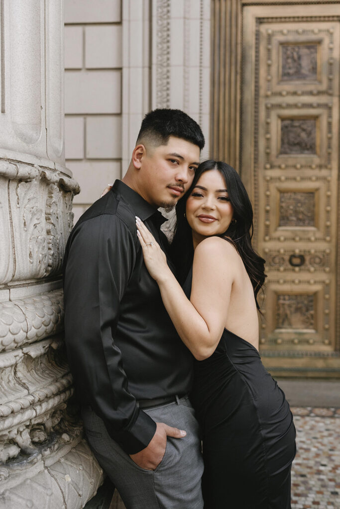 couple downtown taking engagement photos
