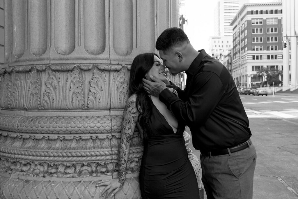 couple downtown taking engagement photos
