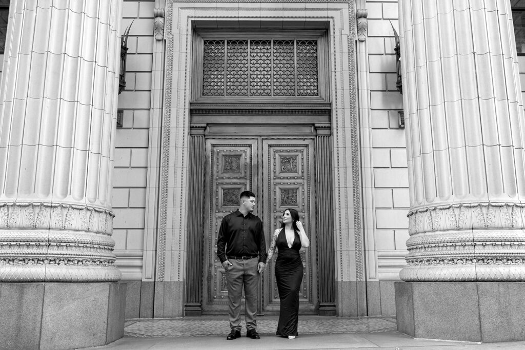 couple downtown taking engagement photos
