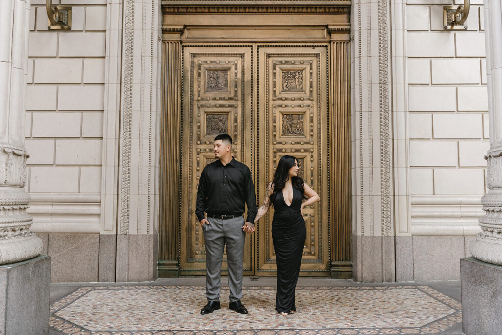 couple downtown taking engagement photos
