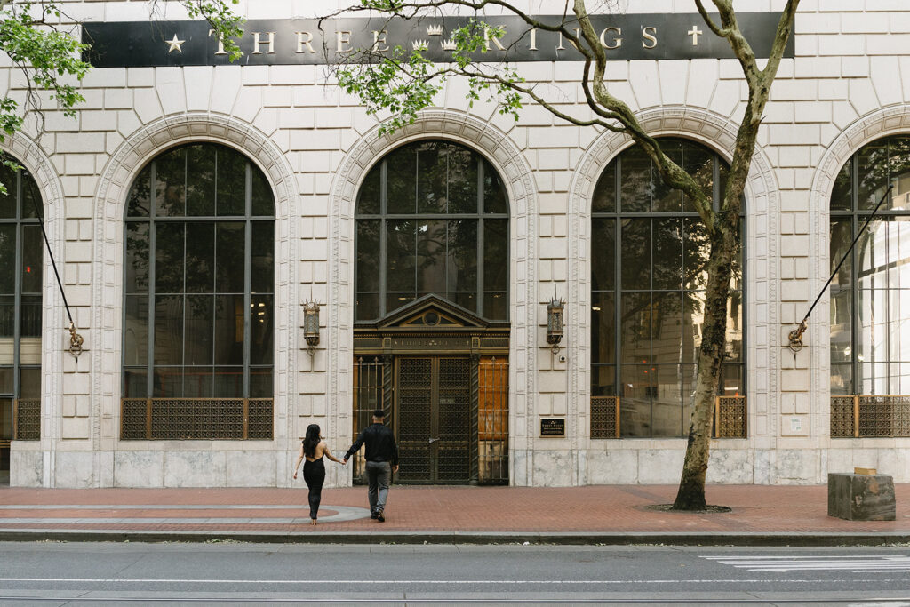 couple downtown taking engagement photos
