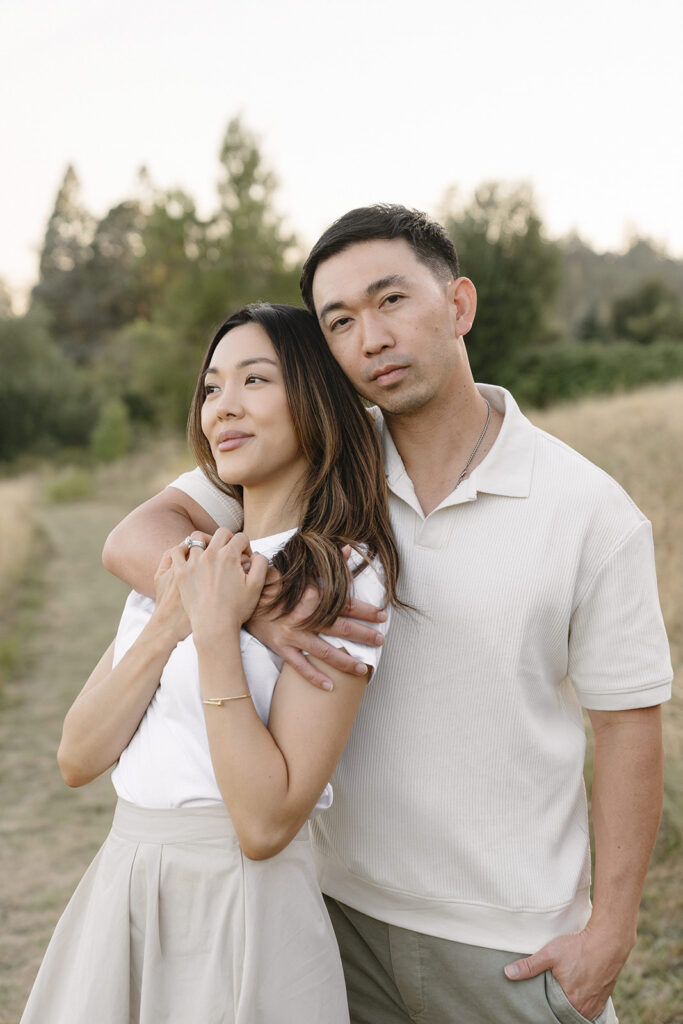 family taking photos in a field
