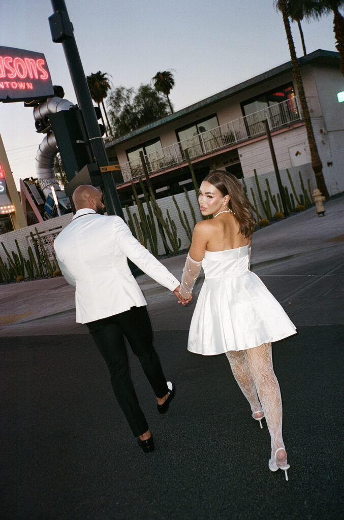 couple taking wedding photos in vegas
