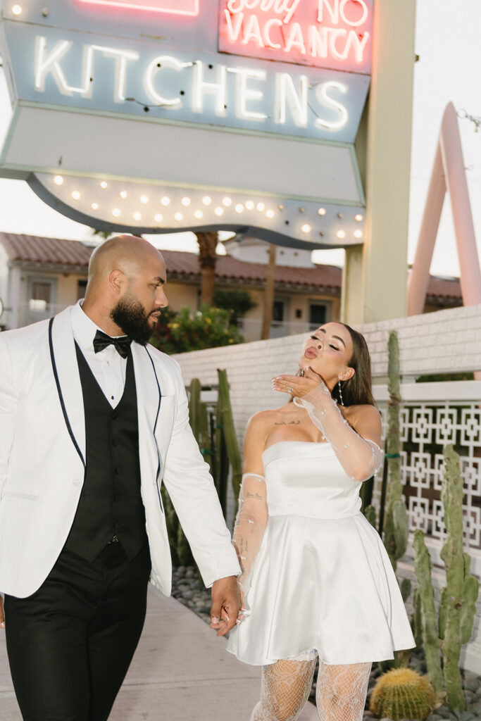 couple taking wedding photos in vegas
