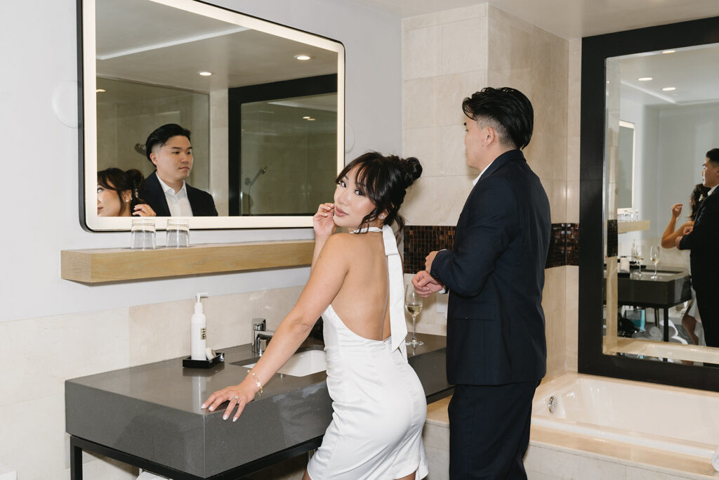 couple taking engagement photos at a hotel
