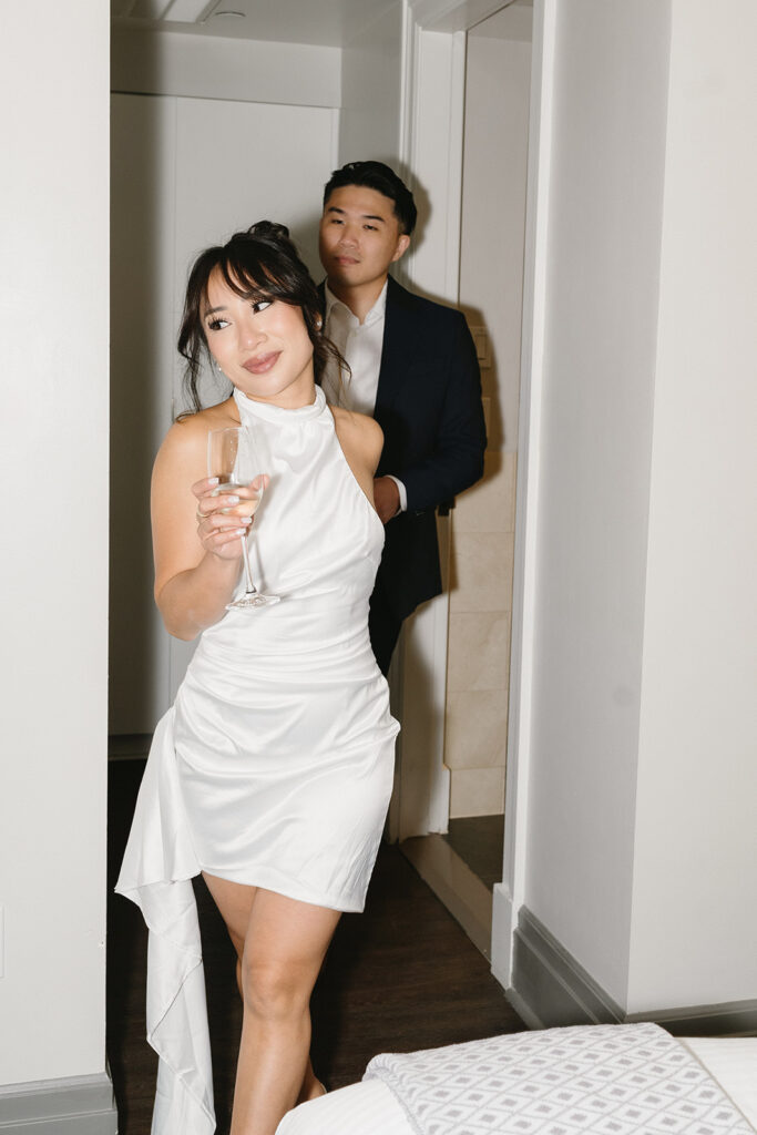 couple taking engagement photos at a hotel
