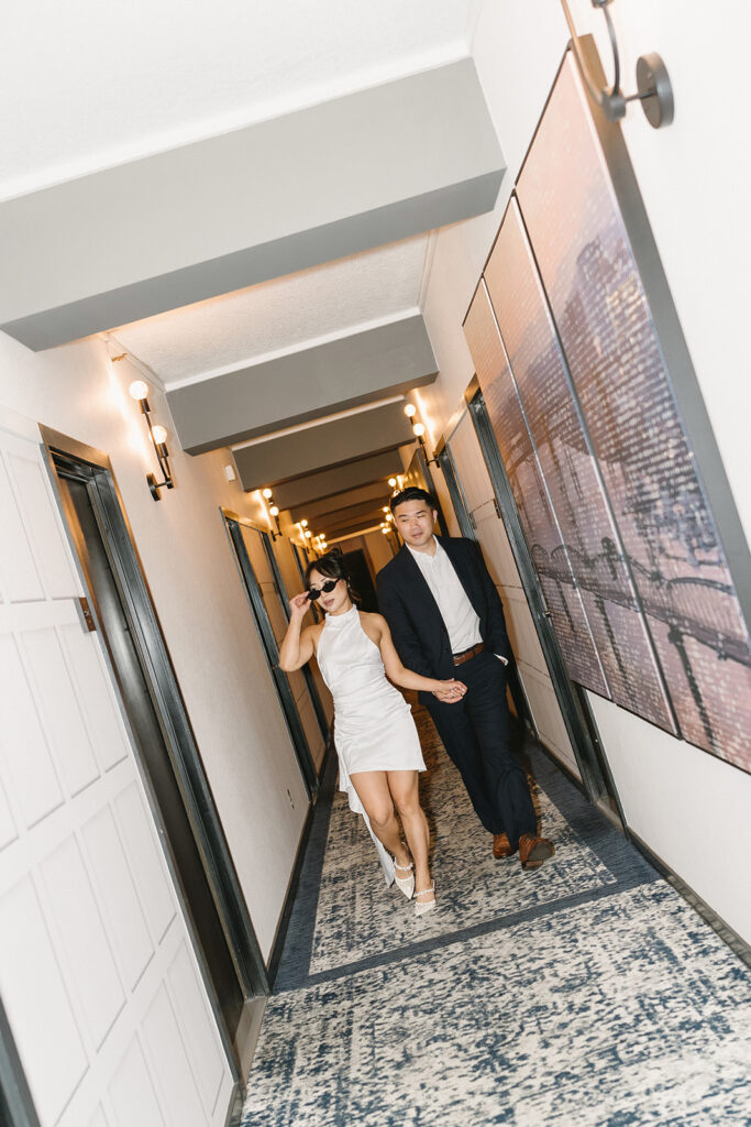 couple taking engagement photos at a hotel
