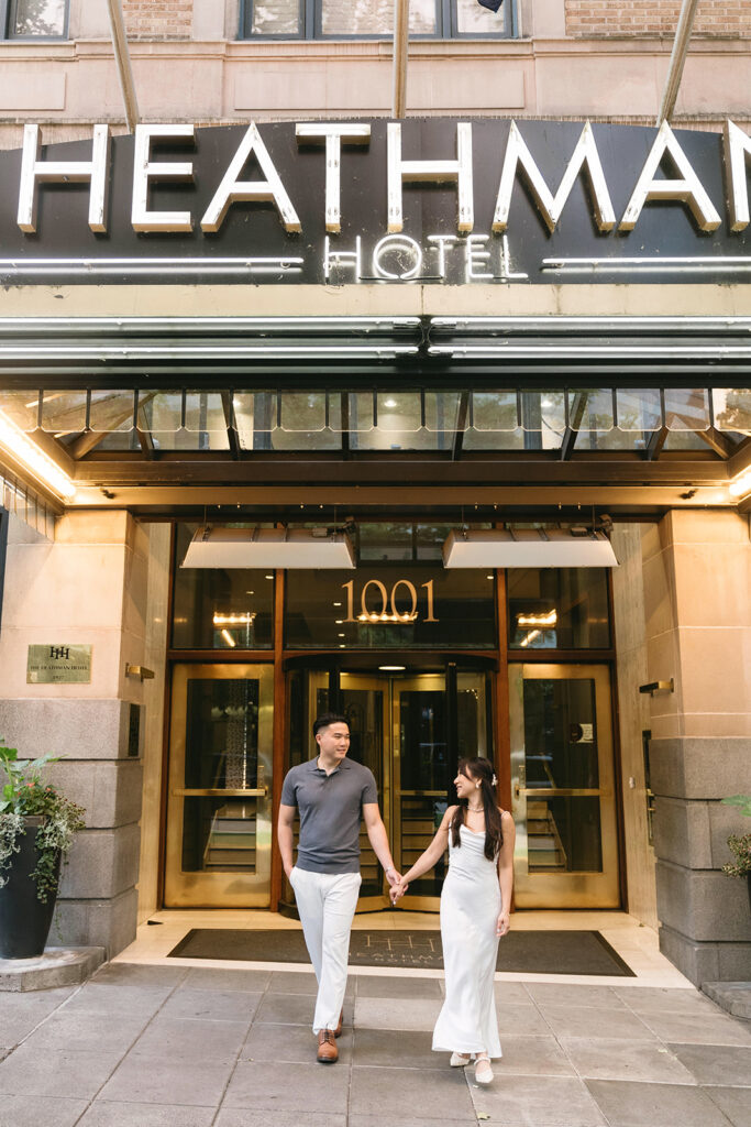 couple taking engagement photos at a hotel
