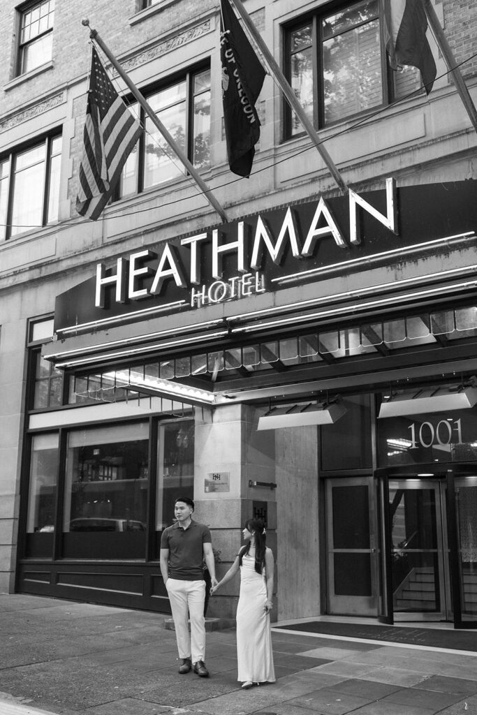 couple taking engagement photos at a hotel
