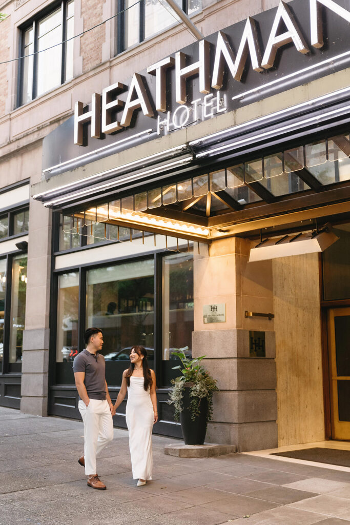 couple taking engagement photos at a hotel
