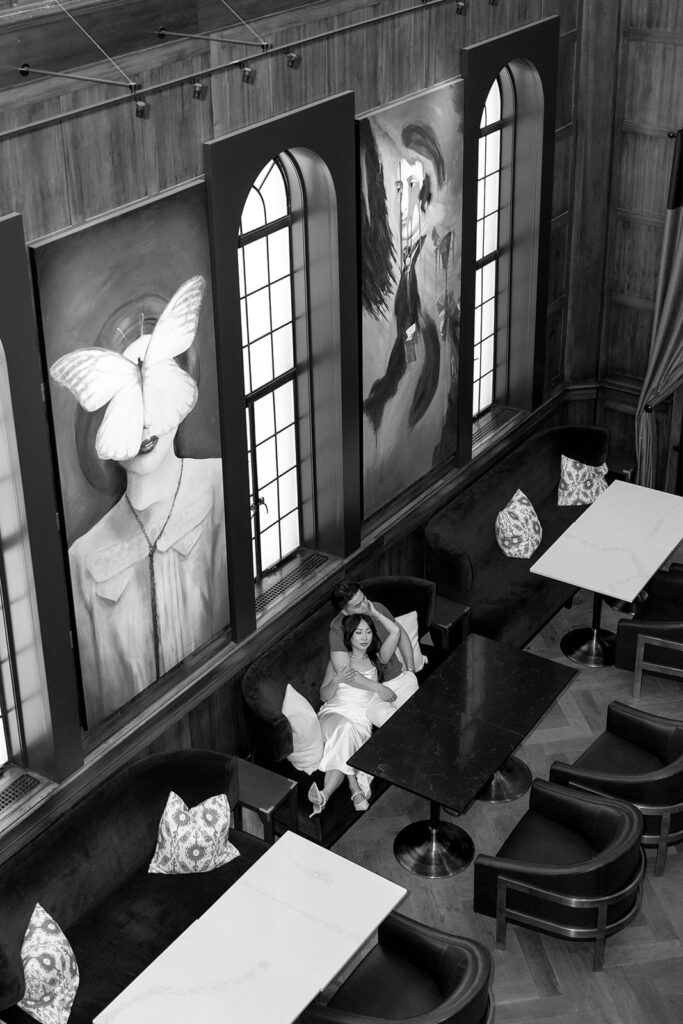 couple taking engagement photos at a hotel
