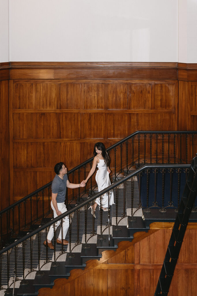 couple taking engagement photos at a hotel
