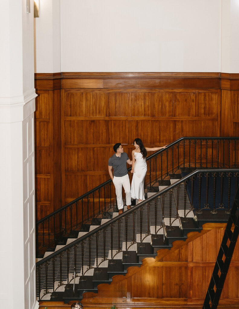 couple taking engagement photos at a hotel
