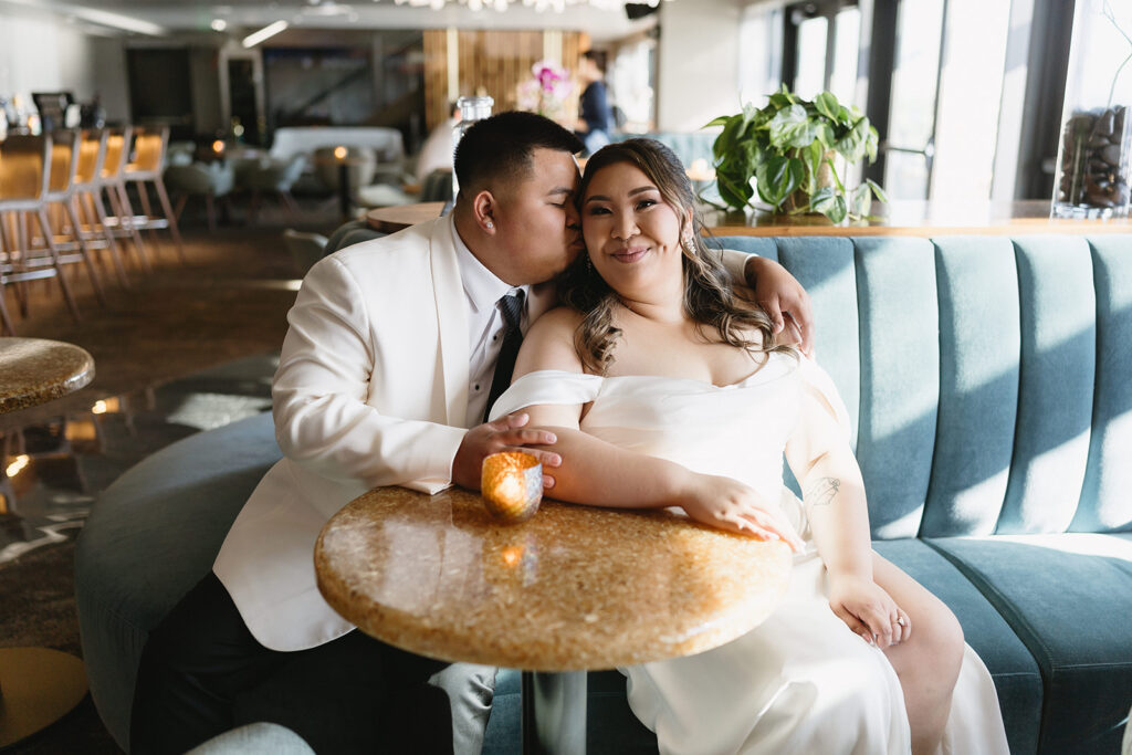 couple taking their elopement photos: An intimate downtown vancouver micro wedding
