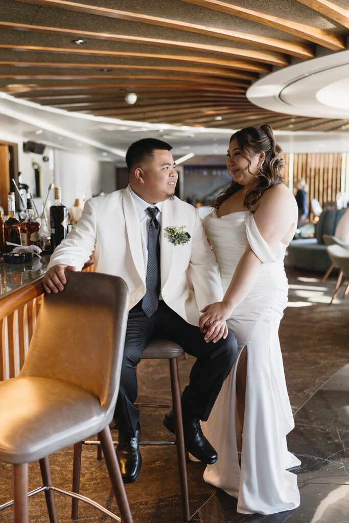 couple taking their elopement photos: An intimate downtown vancouver micro wedding
