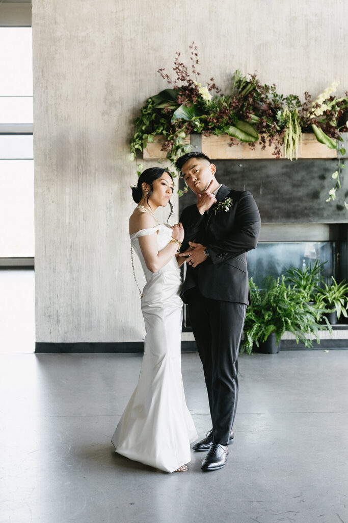 couple posing for their wedding photos 
