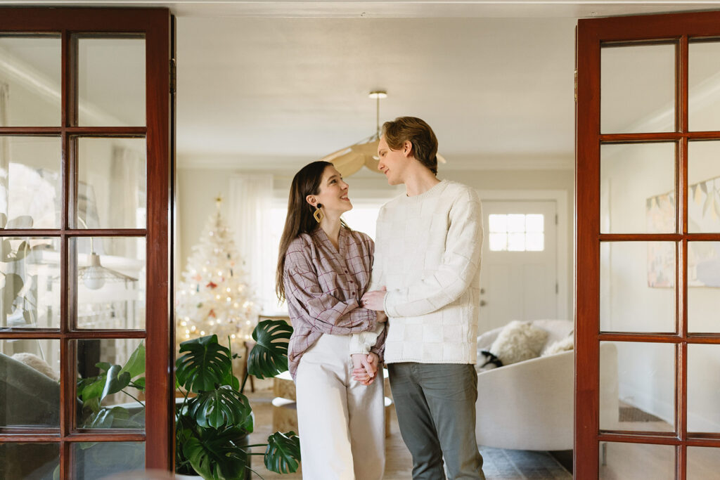 A loving family of three spending time together in their Portland home during an in-home session.
