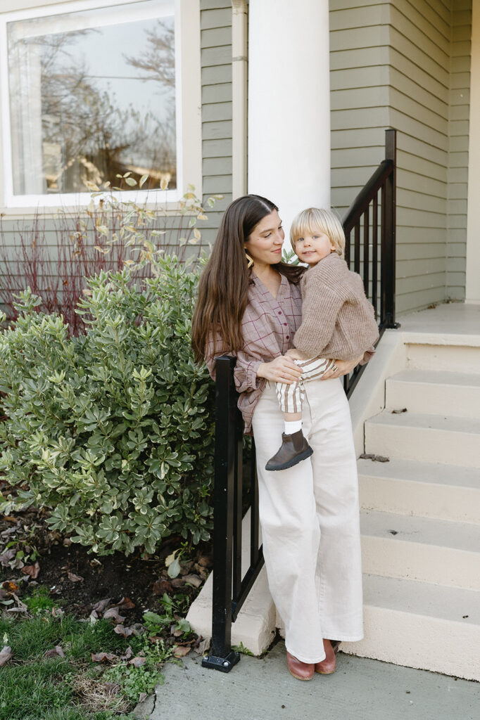 Candid photos of a family of three in their Portland home, surrounded by everyday moments.
