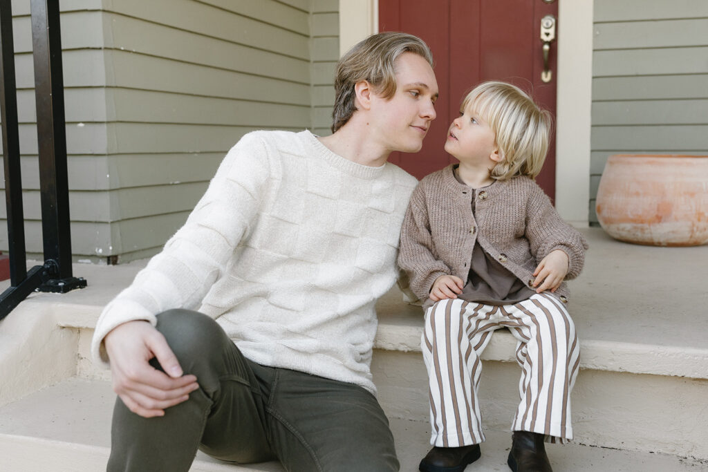 Candid photos of a family of three in their Portland home, surrounded by everyday moments.
