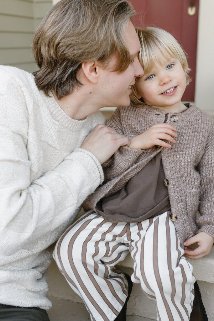 Candid photos of a family of three in their Portland home, surrounded by everyday moments.
