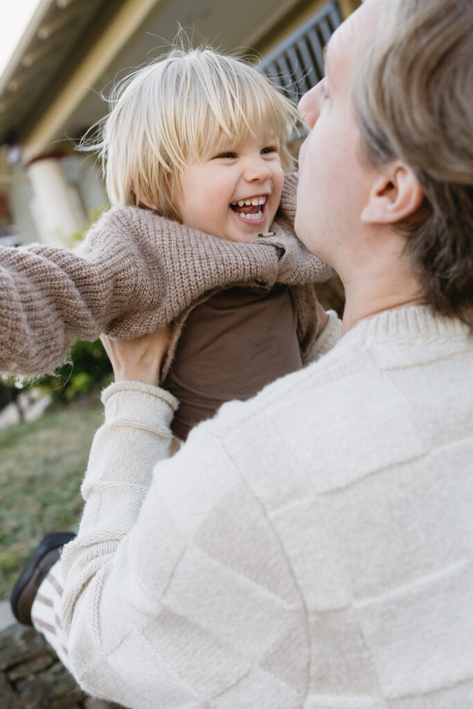 Candid photos of a family of three in their Portland home, surrounded by everyday moments.
