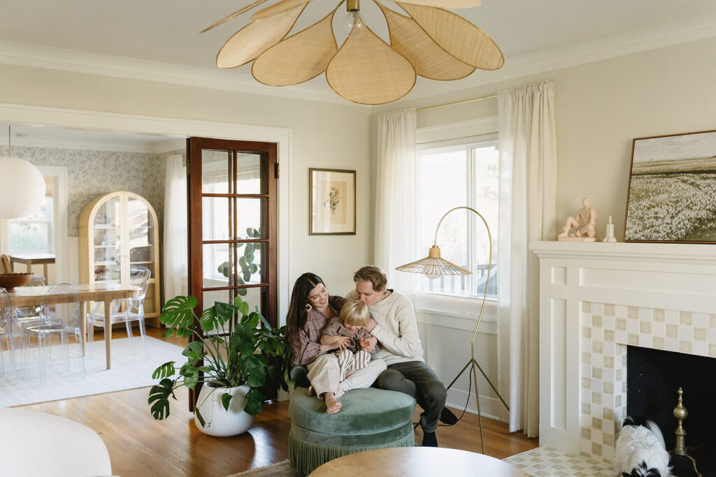 A loving family of three spending time together in their Portland home during an in-home session.
