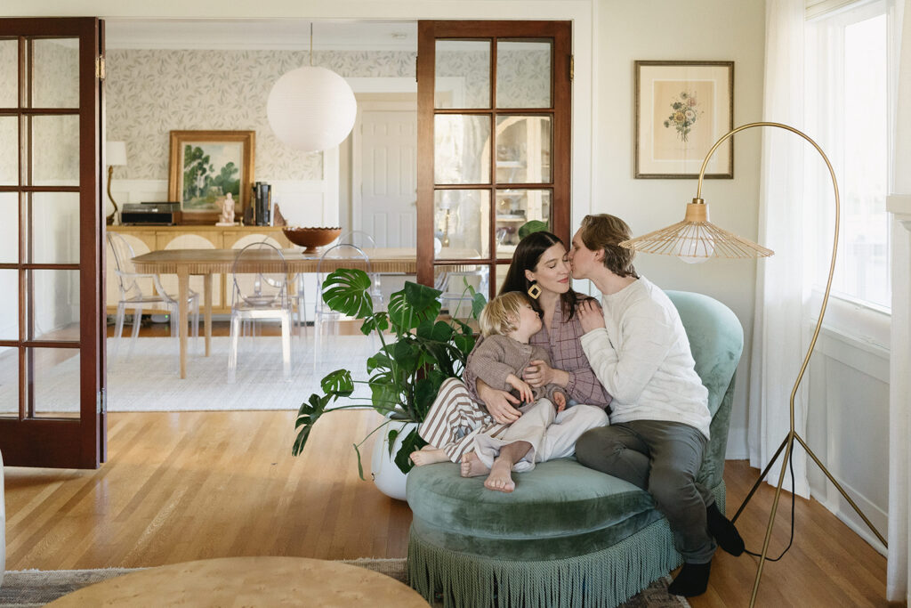 A loving family of three spending time together in their Portland home during an in-home session.
