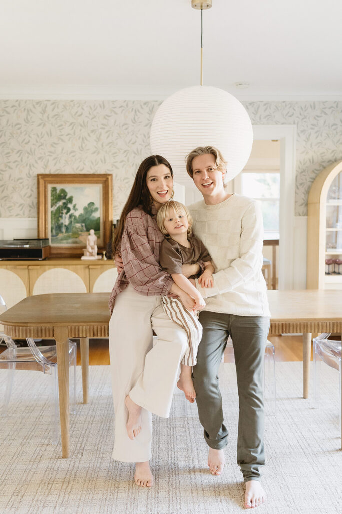 A loving family of three spending time together in their Portland home during an in-home session.
