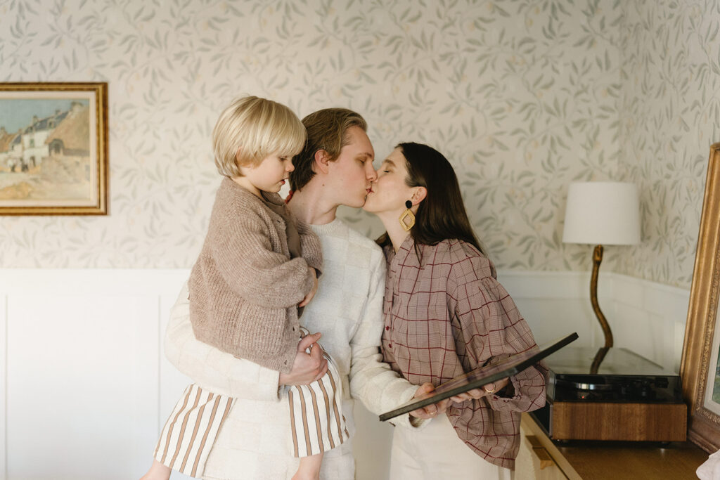 Candid photos of a family of three in their Portland home, surrounded by everyday moments.
