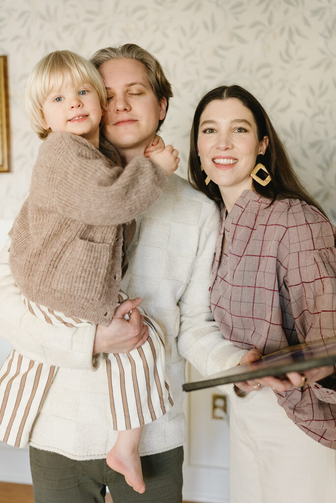 Candid photos of a family of three in their Portland home, surrounded by everyday moments.
