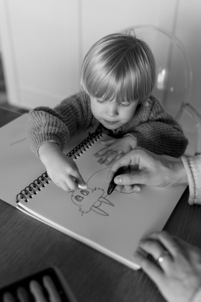 Candid photos of a family of three in their Portland home, surrounded by everyday moments.
