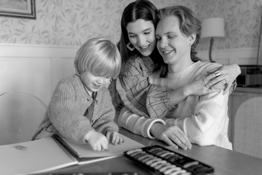 A loving family of three spending time together in their Portland home during an in-home session.
